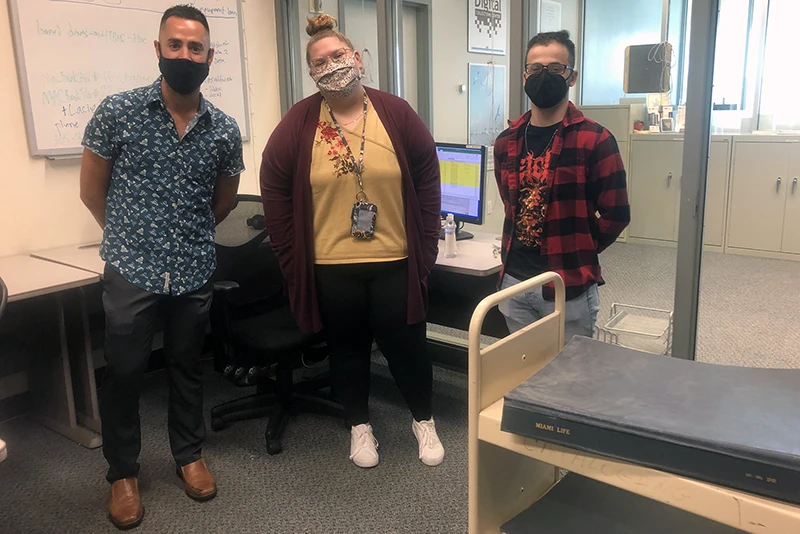 Historian Julio Capó, Jr. with Riley Ford and Roberto Carrodeguas, the graduate student interns who worked with Capó and the FIU Libraries’ Digital Collections Center to scan and digitize select issues of Miami Life.